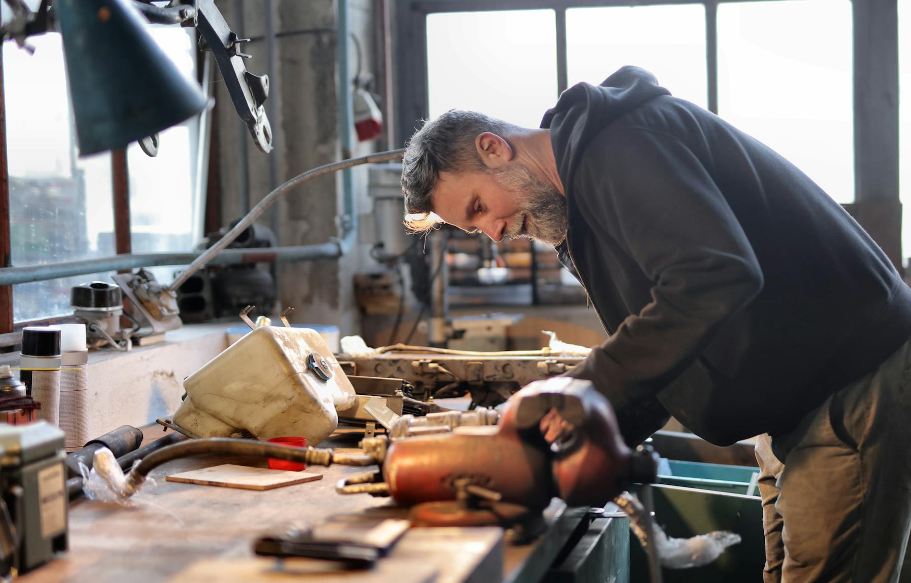 Repair specialist working at a tool bench before a service appointment