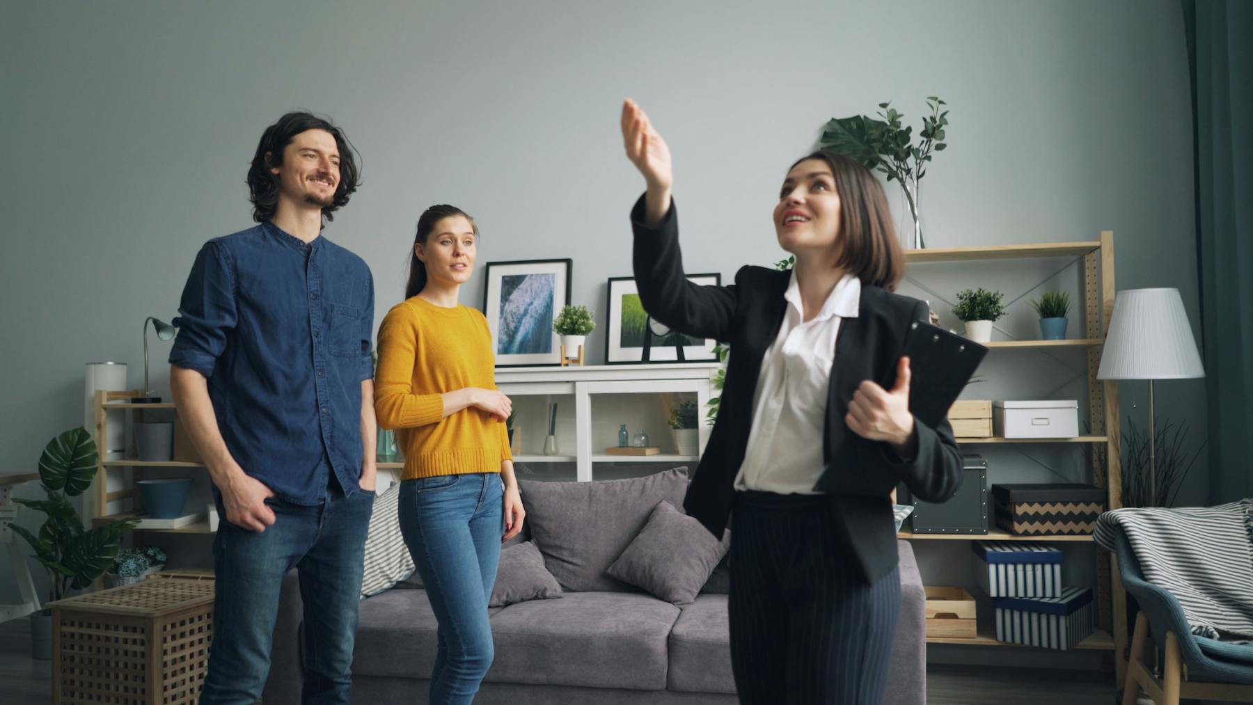 Real estate professionals reviewing transaction documents in a modern office